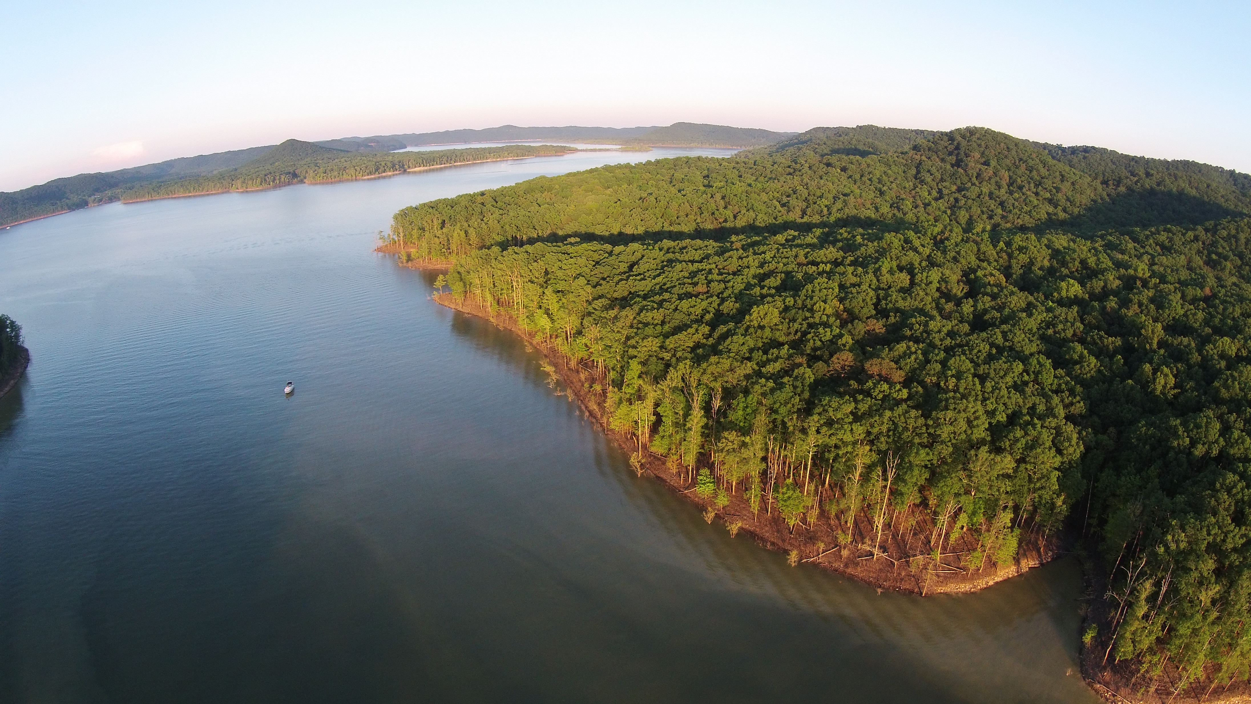 Pontoon on Cave Run Lake, forested ridges beyond